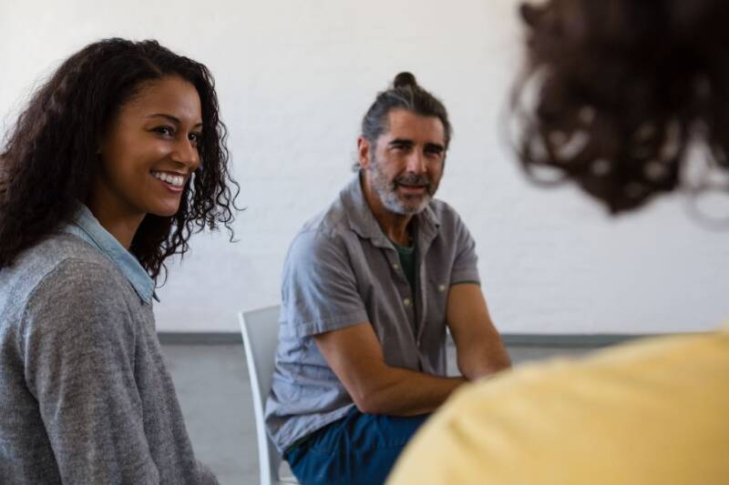 friends looking at man mental health support