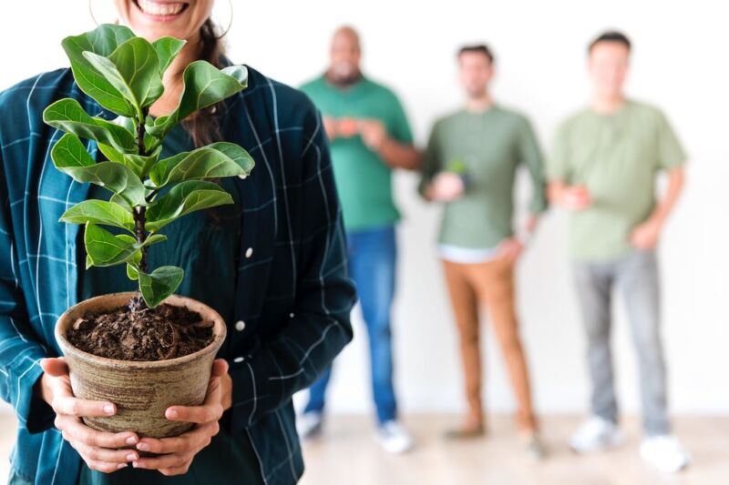 woman holding plant for growth mindset